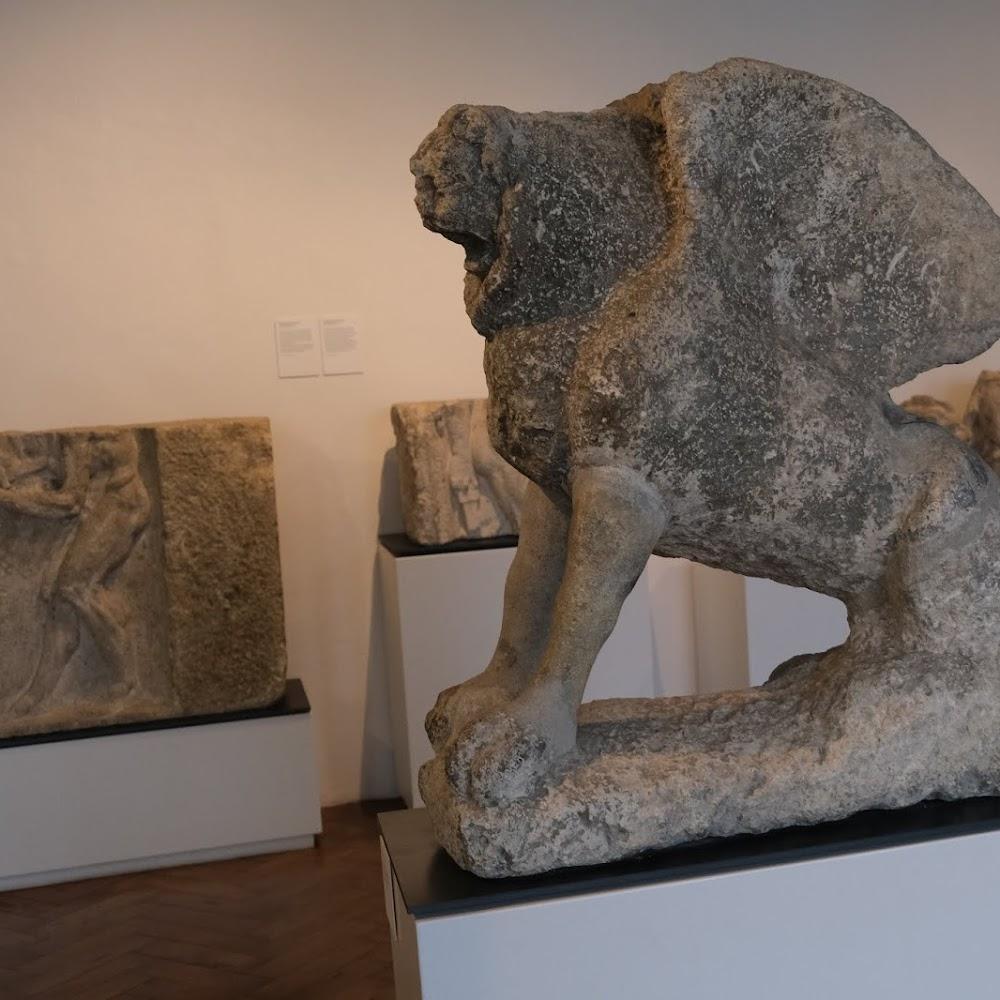 Stone lion sculpture in a museum.